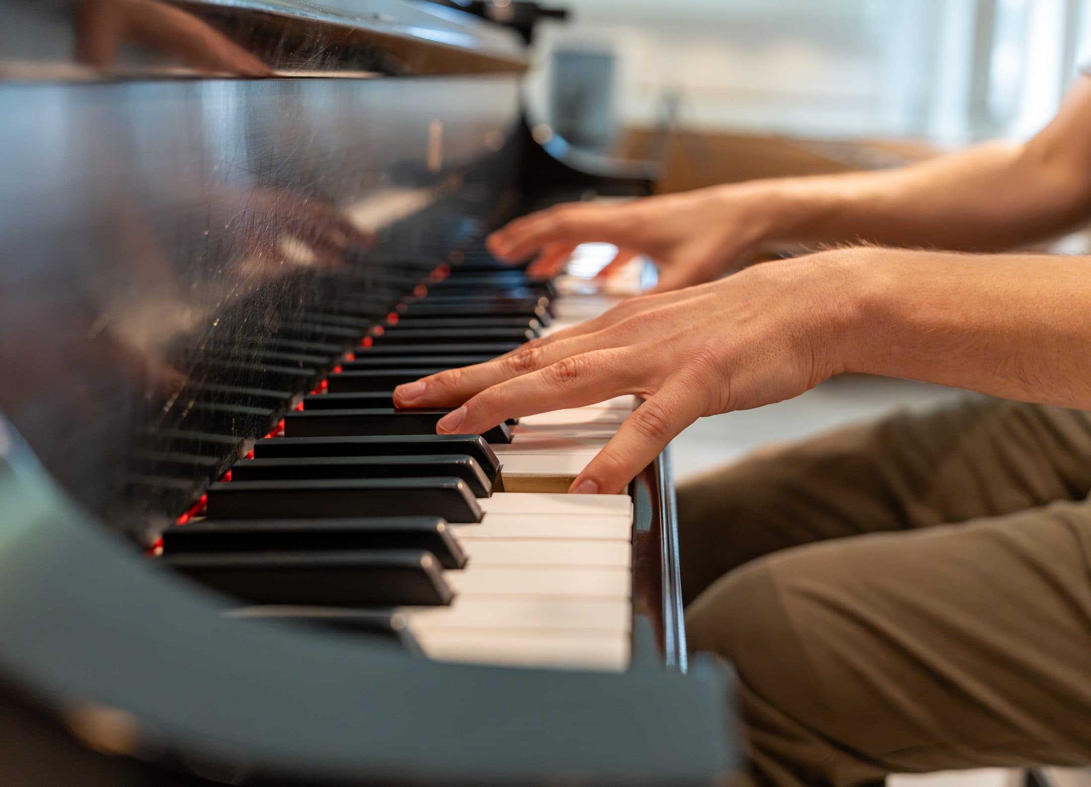 A pianist's hands on the keys, close up